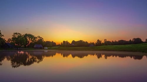 Picturesque View Of Sunset Through Sunrise Over Serene Lake In Countryside. Timelapse