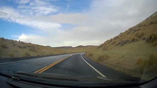 driving on winding canyon road