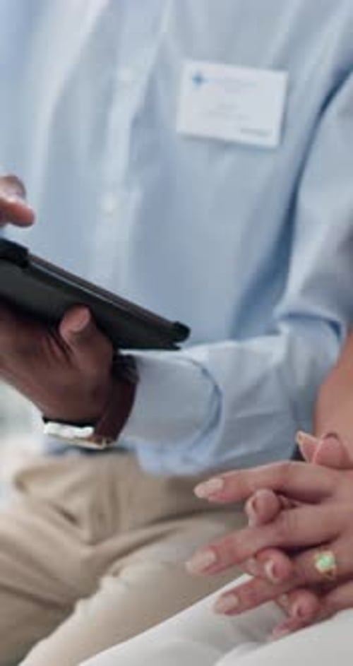 Medical Professional Consulting with Patient at Hospital