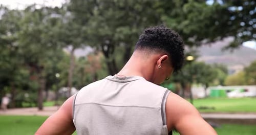 Fitness, neck stretching and man in park for outdoor morning workout in garden from back