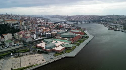 Halic Congress Center and Golden Horn Bridge fly upwards shot