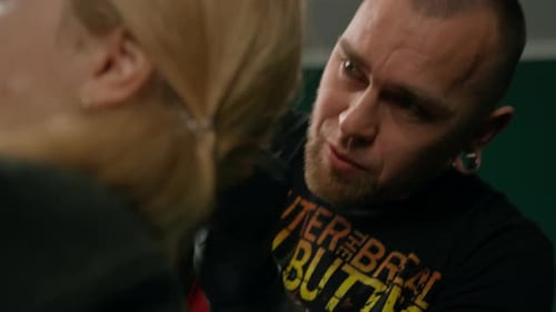 Piercing studio interior - piercing master makes a piercing to a girl, ear piercing