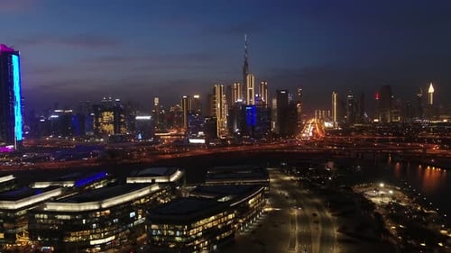 Aerial view of illuminated Dubai skyline at night, United Arab Emirates.