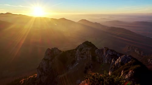 Time-lapse 4K, sunset over the mountain view from the top of the mountain on the wide landscape