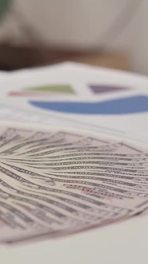 Desk with Dollar, Documents and Laptop in Office, Vertical Video