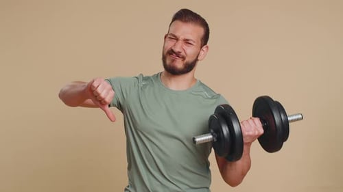 Man Does Dumbbell Curls and Disapproves