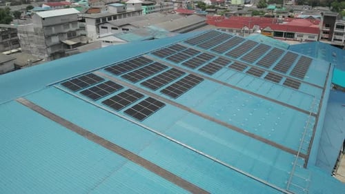 Aerial view of solar cell panels installed on roof of the factory