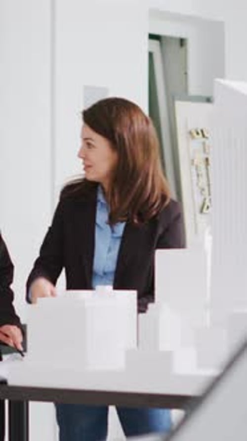 Vertical Video Designers Give a High Five After Drafting Objectives