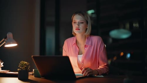 Thoughtful Entrepreneur Solving Business Tasks at Night Workplace Closeup
