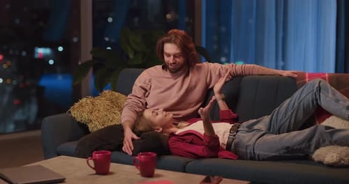 Woman Lying on Her Boyfriend Knees Taling About Daily News Communicating on Cozy Late Evening