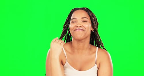 Comic, funny and humor with a black woman on a green screen background laughing or joking in studio