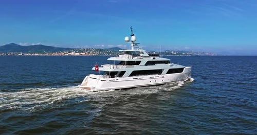 Aerial View Tracking of Beautiful Modern White Superyacht Lifestyle Luxury Boat Sailboat