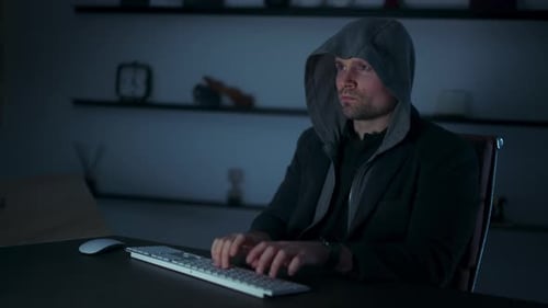 Man at Computer Keyboard Using Hands as Interface
