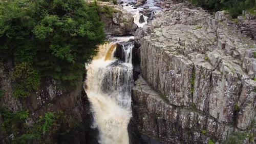 High Force Waterfall in Middle-in-Teesdale, County Durham, top down aerial 4K HD Drone Drop Down