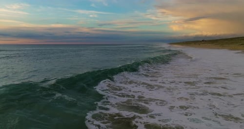 Aerial View Ocean Beach Sunset and Dramatic Colorful Sky Clouds