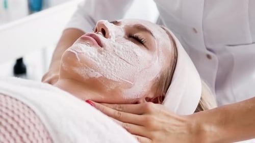 Beautician cosmetologist makes a massage cervical collar zone, professional cosmetic procedure