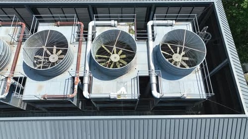Static Aerial of Urban Rooftop With Cooler Units and Linear Infrastructure Layout