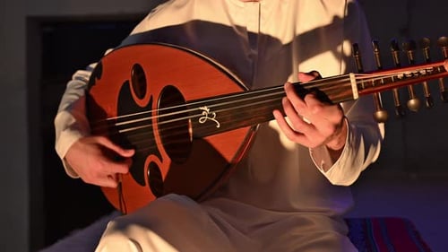 The oud, a staple of Arabic music, is played here by an Arab musician with deep cultural roots.
