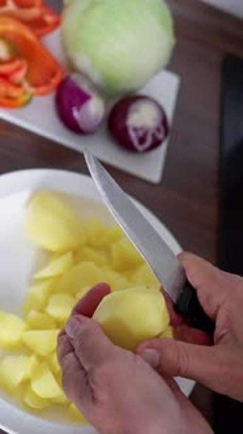 Cooking Prep Scene Home Cook Peeling Potatoes for Family Meal Closeup of Hands Peeling Potatoes Over