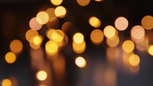Holidays And Celebration Concept - Blurred Christmas Lights In Darkness