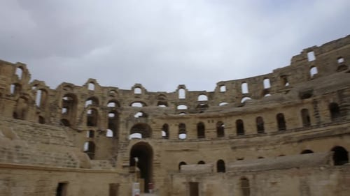 Famous Archeological Landmark Of El Jem Amphitheater In Tunisia - panning shot