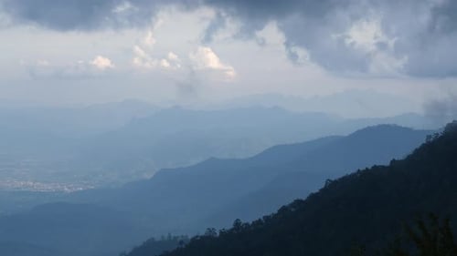 Aerial view of sea of fog on tropical mountains in the early morning.