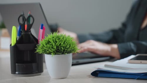 Close Up of Woman Typing Then Reaching for Coffee and Returning to Work