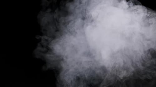 White Smoke on a Black Background in Slow Motion Explosion Steam