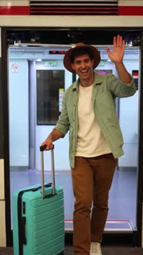 Man Traveling with Rolling Suitcase in Urban Area