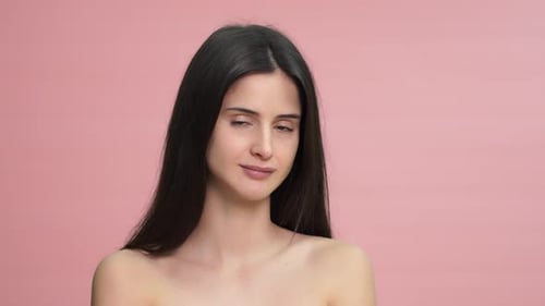 Beautiful Young Woman Smiling in Studio Portrait