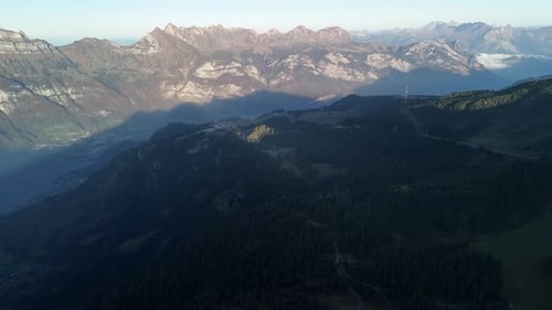 Swiss alpine nature landscape aerial drone Switzerland over forest valley