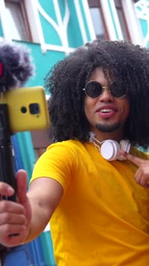 Young Adults Filming Video Blog on City Street