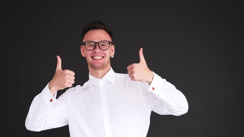 Smiling Man Gives Thumbs Up and Thumbs Down