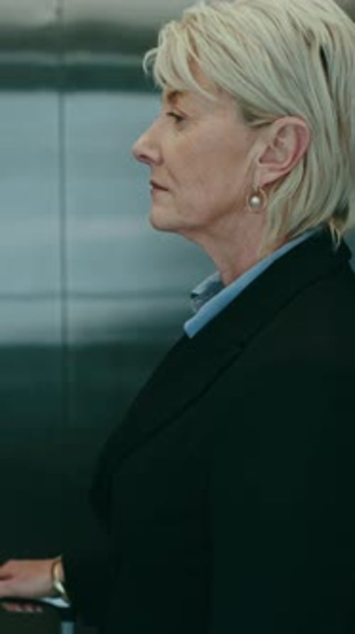 Elevator, luggage and business woman in hotel, airport and walking in lobby