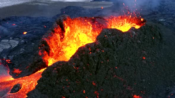 A 4K, aerial cinematic shot of an angry volcano showing rapid erupting ...