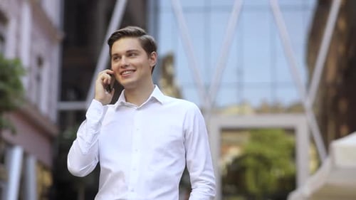 Attractive Successful Business Man Speak on Phone on the City Business District Street Mobile