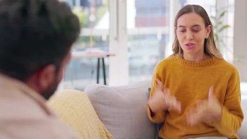 Young Woman Talks in Living Room, Mid Shot