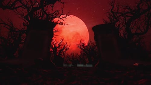 Spooky Graveyard and Dark Forest Silhouetted by a Massive Red Blood Moon