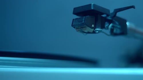 Record Player Stylus Touches Vinyl Record in Macro