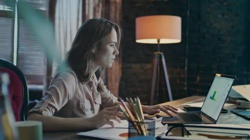 Business Woman Working on Laptop in Office. Business Analytics. Serious Marketer Doing