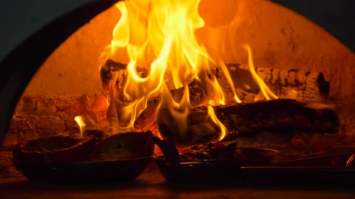 Bright Flames Burning in an Oven with Food