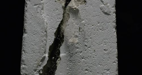 Impact Collection: Effect of a white concrete block breaking slowly