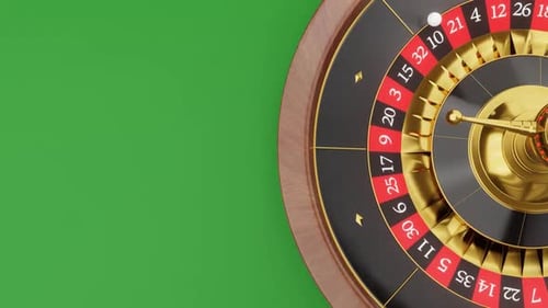Close-up of a Roulette Wheel on Green Background