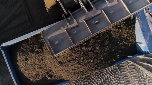 The Construction processSceneLarge Machines in Which Cement Lies and Which are Removed From a Height