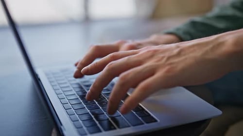 Man Hands Typing Keyboard of Laptop in Light Office Closeup Guy Fingers Working