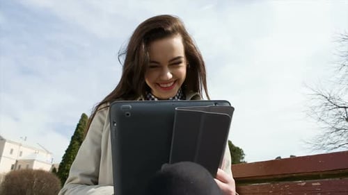 Colorful Close Up of Using Tablet in the Park