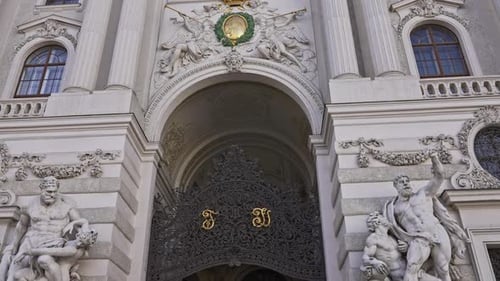 Baroque statues at the gate entrance to the Hofburg Palace on Michaelerplatz in Vienna, Austria