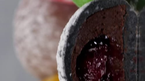 Vertical Video Six Cut Mochi Cakes Spin on a Mirror Surface Presentation of Flavors