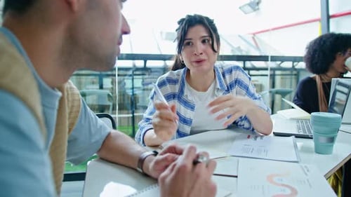 Young Adults Collaborating at Modern Workplace