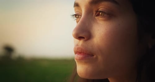 Close Up Portrait of a Beautiful Young Female Looking into the Distance. Smiling Girl with